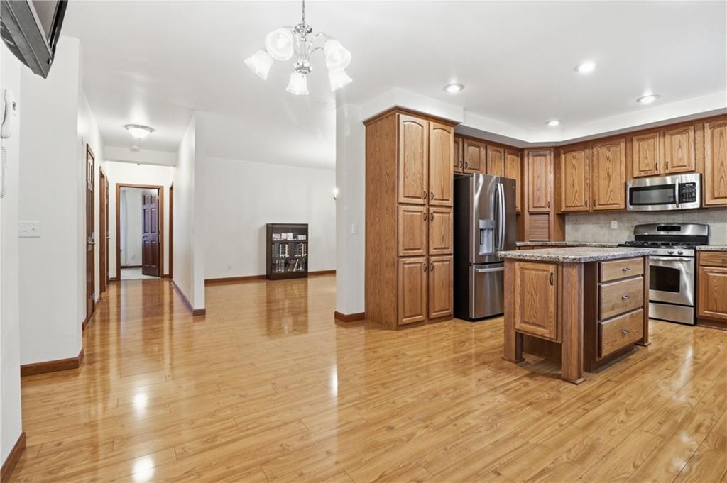 197 Smugglers Road Du Bois, PA 15801 - Photo 20 of 41 a kitchen with stainless steel appliances granite countertop a refrigerator oven a sink dishwasher and white cabinets with wooden floor