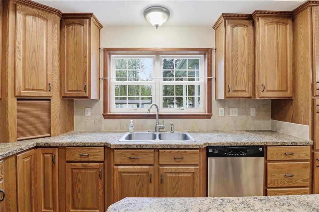 197 Smugglers Road Du Bois, PA 15801 - Photo 23 of 41 a kitchen with stainless steel appliances granite countertop a sink and cabinets with wooden floor