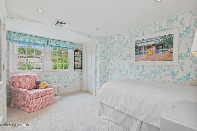 a bedroom with a bed and a couch