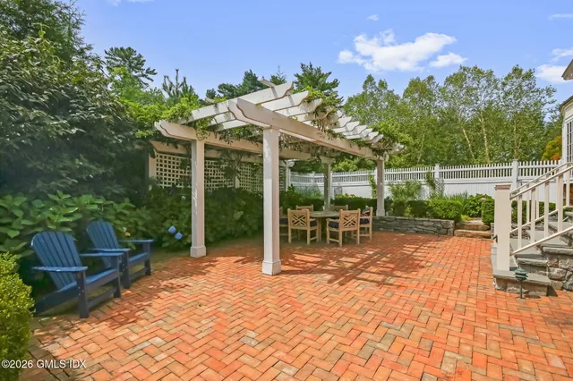 a view of a chair and tables in the patio
