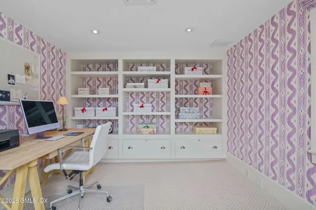 a workspace with furniture and bookshelf