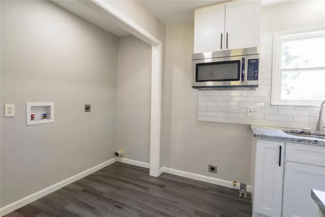 a view of microwave and sink