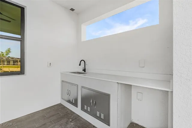 a view with a sink and a mirror