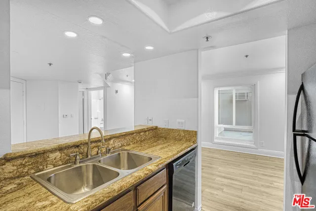a bathroom with a sink double vanity and a mirror