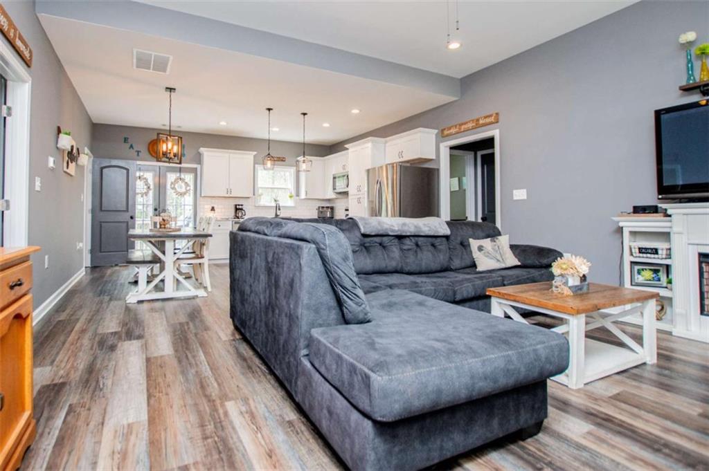133 Pebblebrook Way Temple, GA 30179 - Photo 14 of 65 a living room with furniture and a flat screen tv