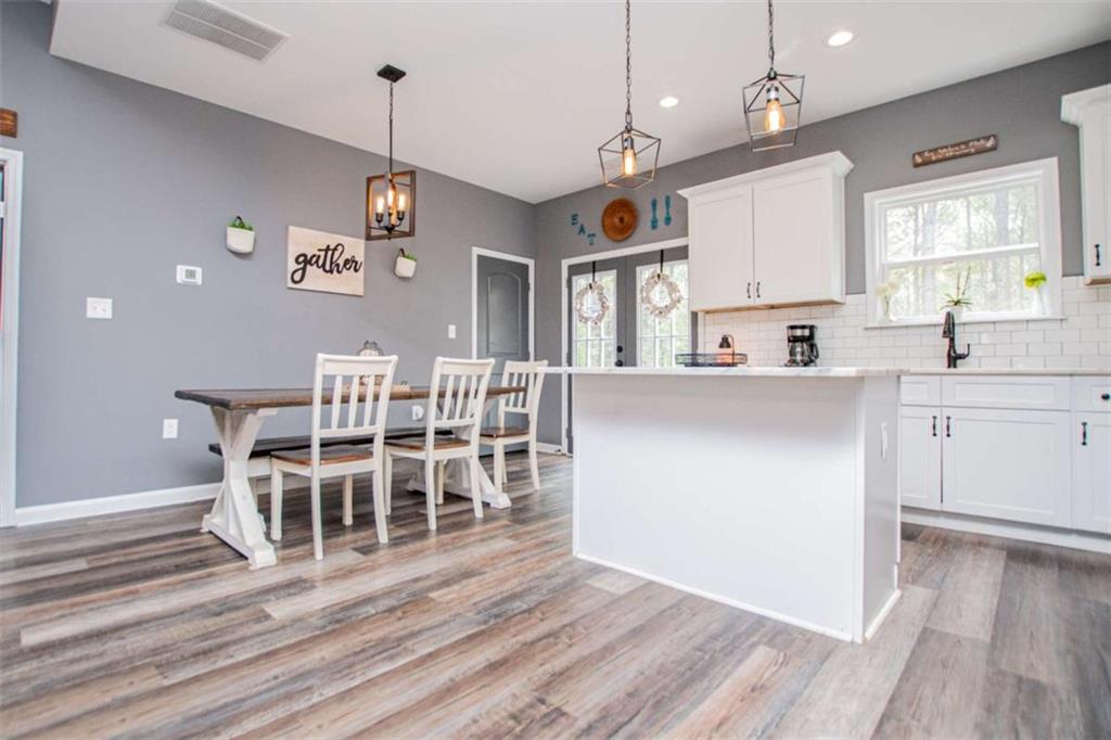 133 Pebblebrook Way Temple, GA 30179 - Photo 21 of 65 a kitchen with cabinets and wooden floor
