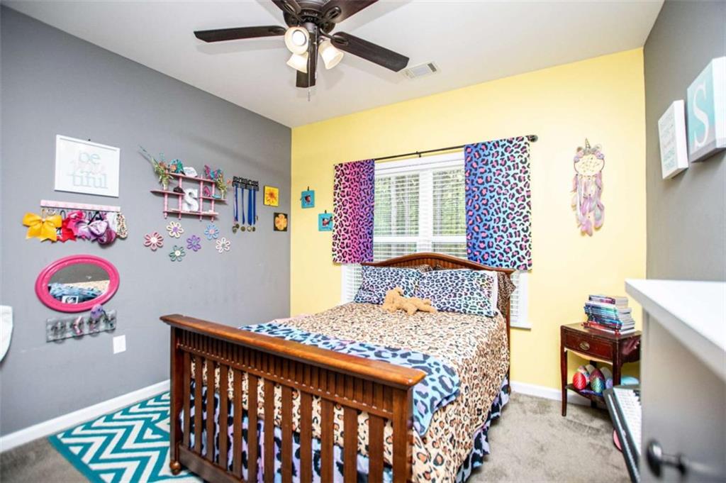 133 Pebblebrook Way Temple, GA 30179 - Photo 35 of 65 a bedroom with a bed and a table in it