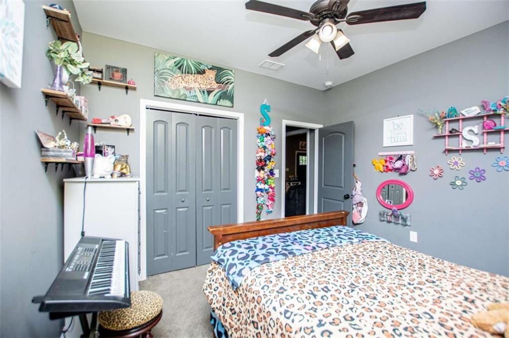 133 Pebblebrook Way Temple, GA 30179 - Photo 36 of 65 a bedroom with a bed and a dresser