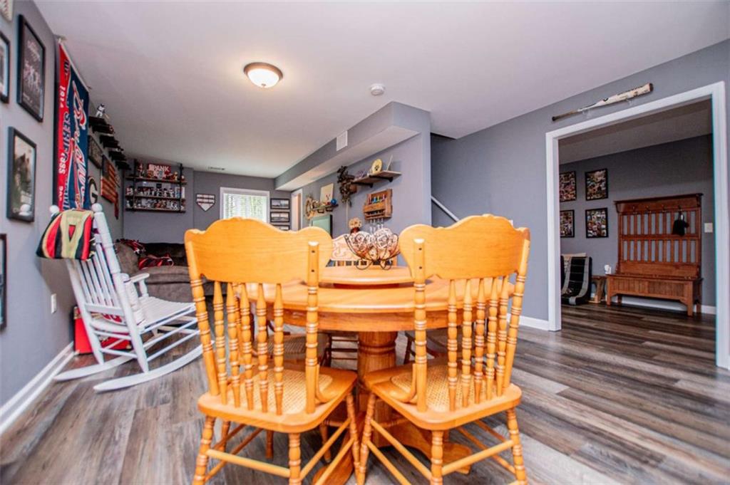 133 Pebblebrook Way Temple, GA 30179 - Photo 45 of 65 a view of a dining room with furniture and wooden floor