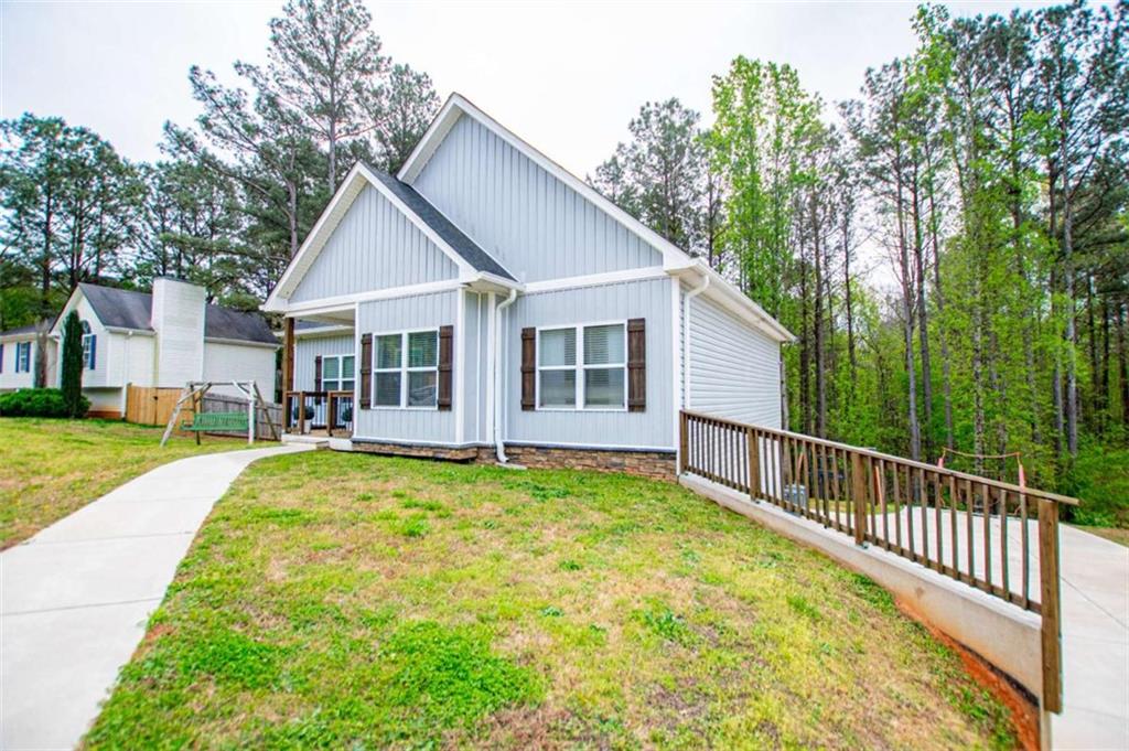 133 Pebblebrook Way Temple, GA 30179 - Photo 5 of 65 a view of a house with backyard and garden