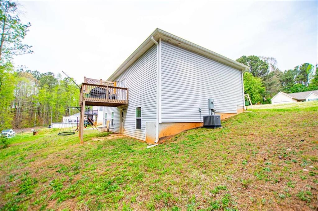 133 Pebblebrook Way Temple, GA 30179 - Photo 58 of 65 a view of a house with a yard and sitting area