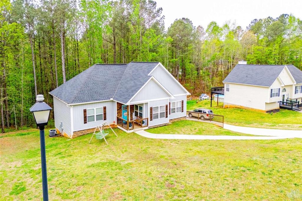 133 Pebblebrook Way Temple, GA 30179 - Photo 63 of 65 a view of a house with pool and a yard
