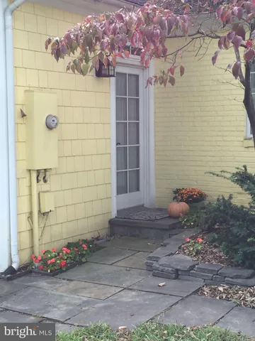 a view of a wooden door and a window