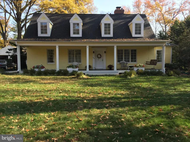 a kitchen with stainless steel appliances granite countertop a stove top oven a sink dishwasher and a refrigerator