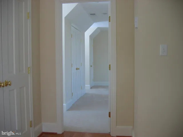 a view of a bathroom from a hallway