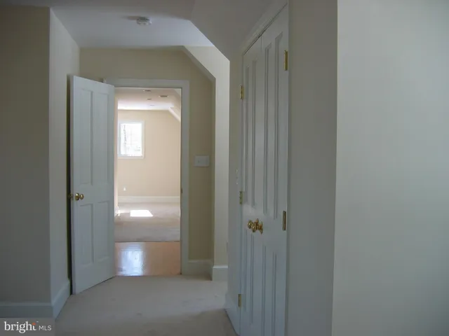 a view of a hallway with a room
