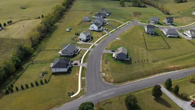 an aerial view of a house with outdoor space