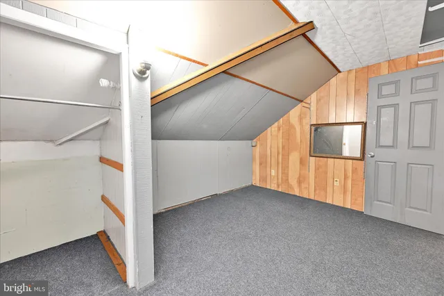 a view of a house with a yard and garage