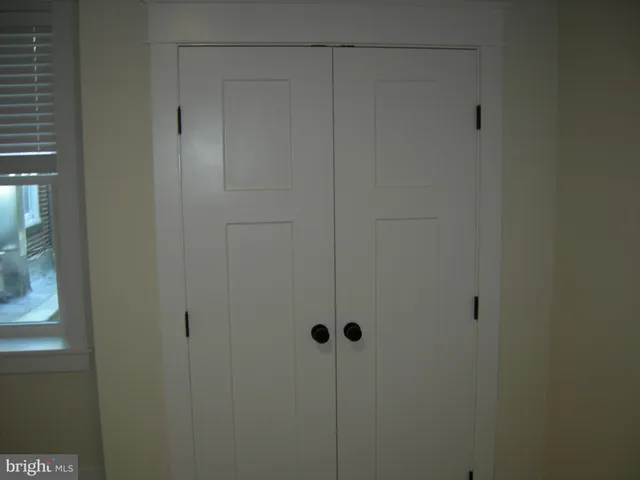 a view of a room that has a window in it