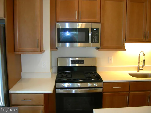 a kitchen with a stove and a microwave