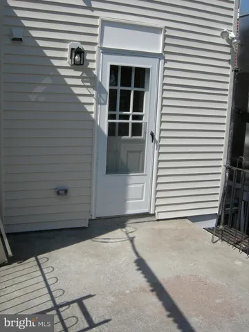 a view of front door and deck