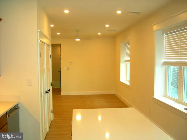 a view of a hallway with windows