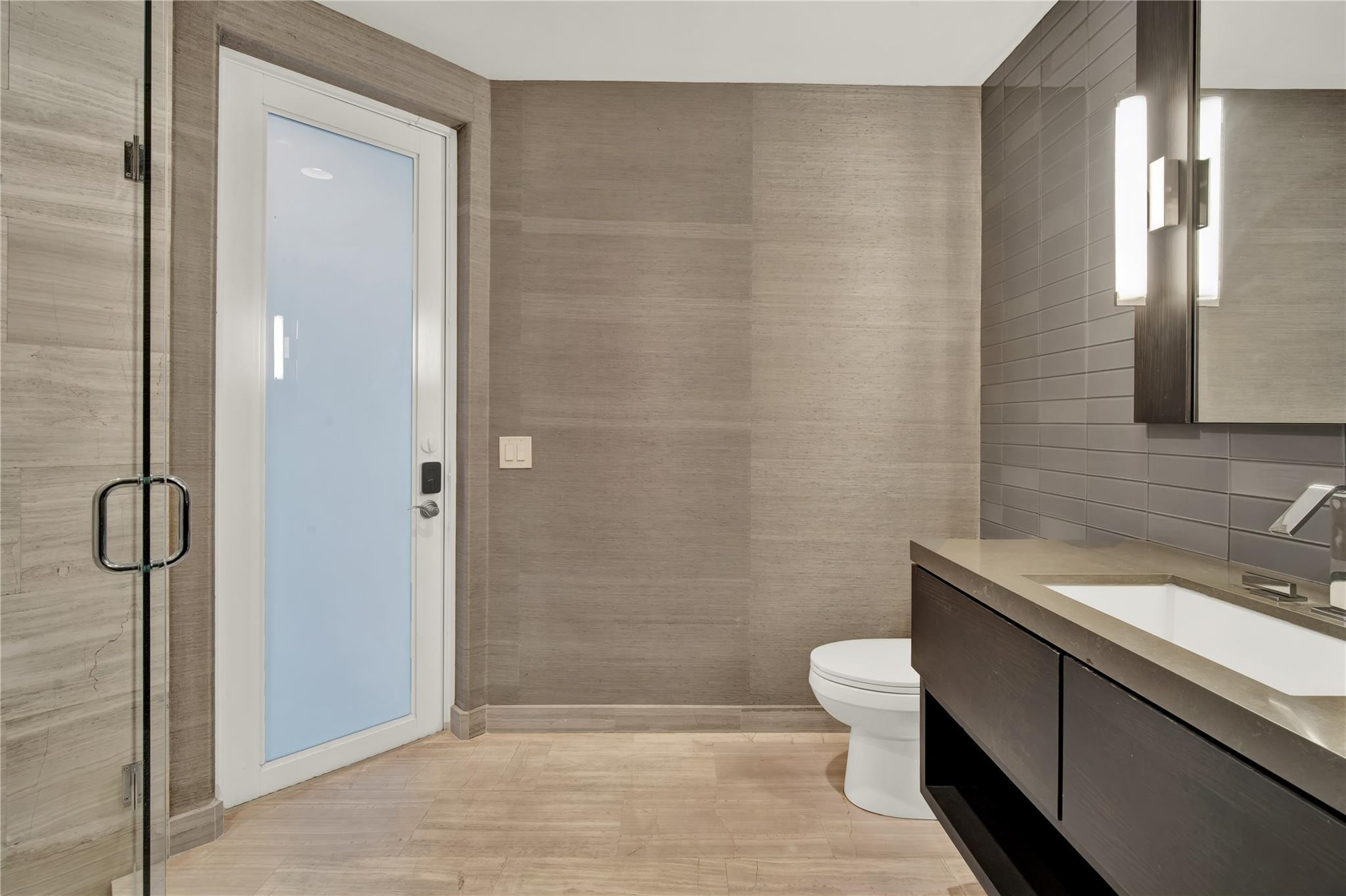 425 North Ocean Boulevard, Unit 3 Boca Raton, FL 33432 - Photo 10 of 69 a bathroom with a sink a toilet and shower