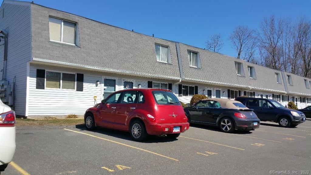 1568 Meriden Road, Unit 1D Waterbury, CT 06705 - Photo 2 of 2 a car parked in front of a building