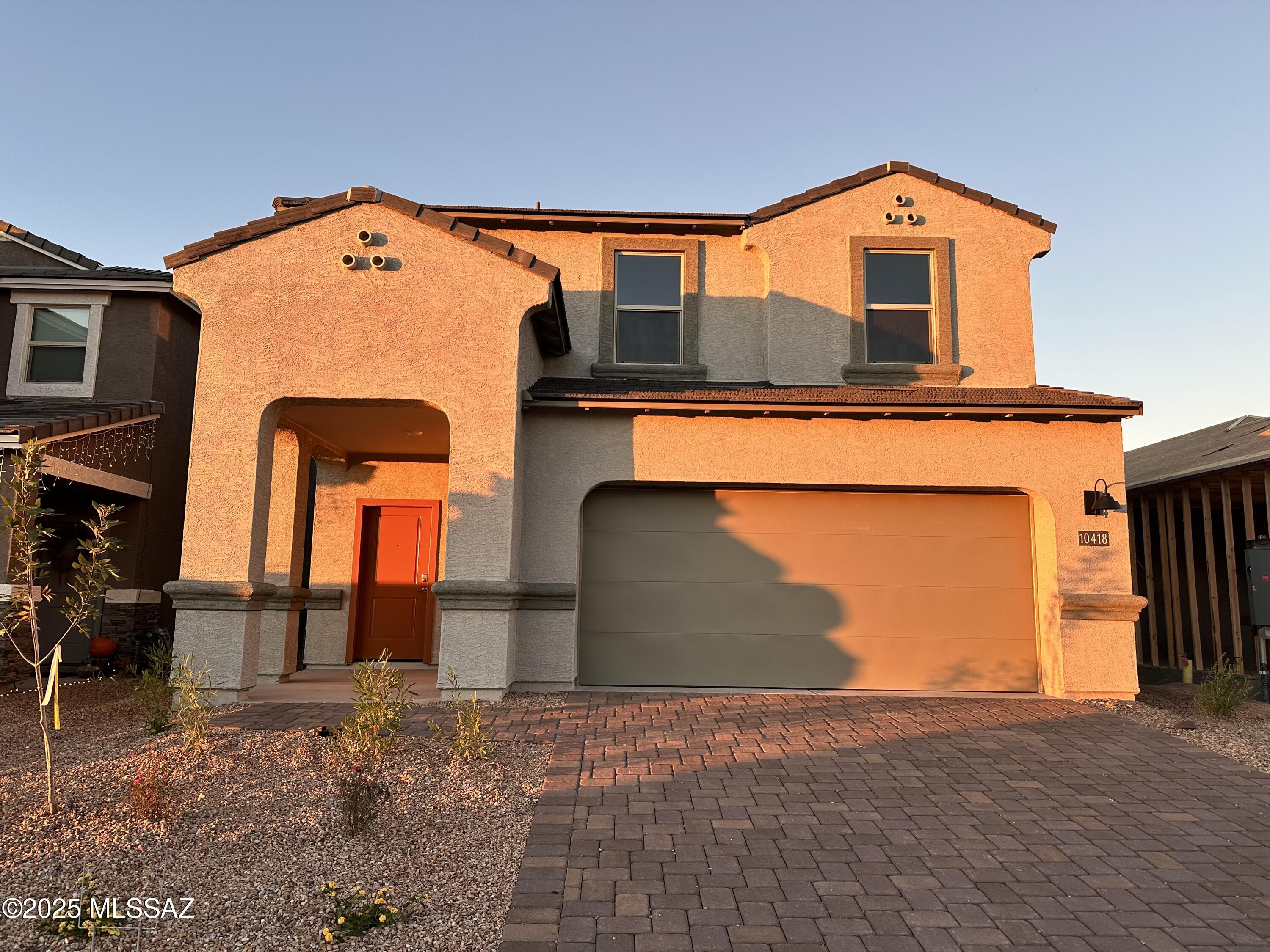 10480 West Rutherford Lane Marana, AZ 85653 - Photo 1 of 19 *Photographs are of a Grace home and are for illustration purposes only. Photographs may show sales offices in model homes where garage location would be. Interior packages, exterior elevation, color and structural options may vary.*