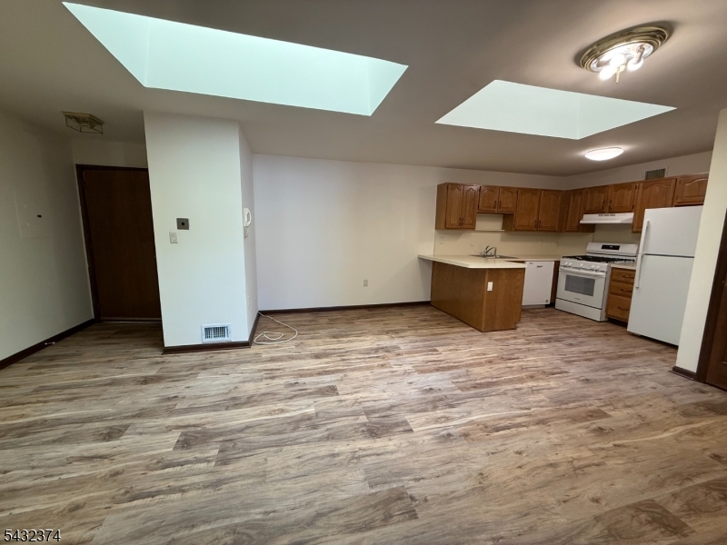 551 Valley Road, Unit 2 Montclair, NJ 07043 - Photo 9 of 9 a room with furniture and a window