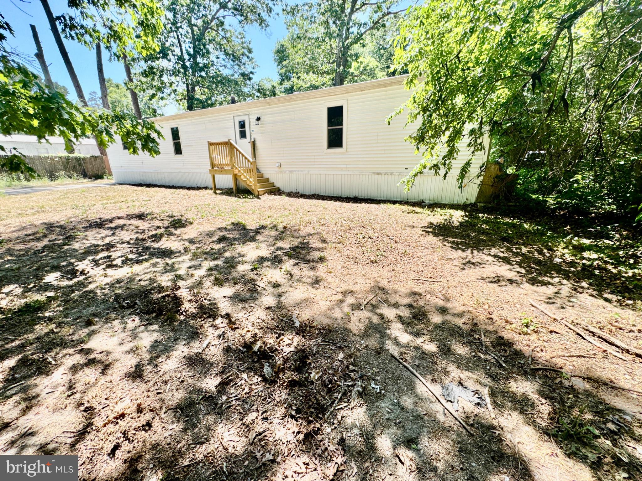 448 Evergreen Road Millville, NJ 08332 - Photo 4 of 25 a street view with yard