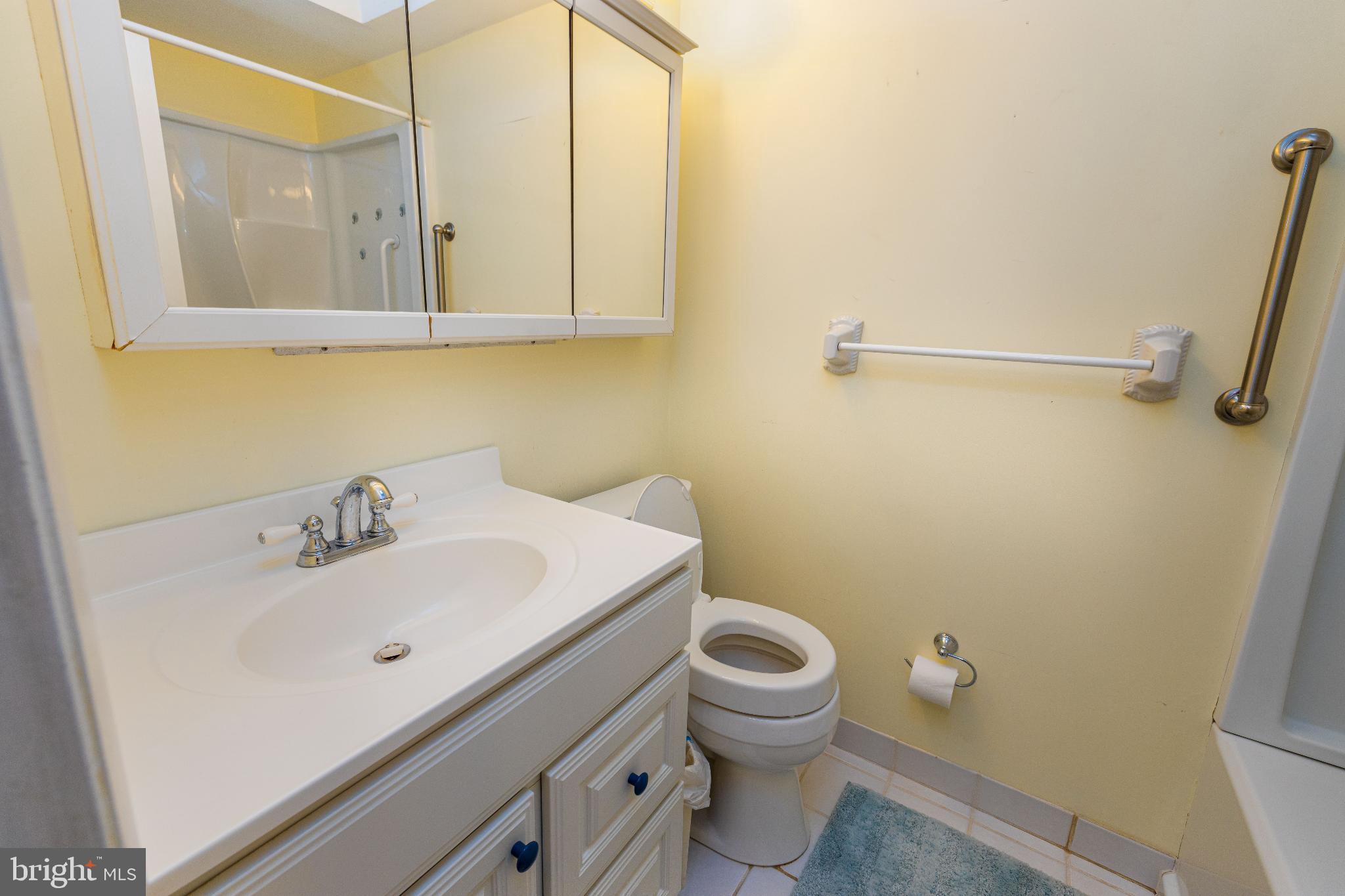 12704 Minden Road Philadelphia, PA 19154 - Photo 16 of 23 a bathroom with a sink a toilet and a mirror