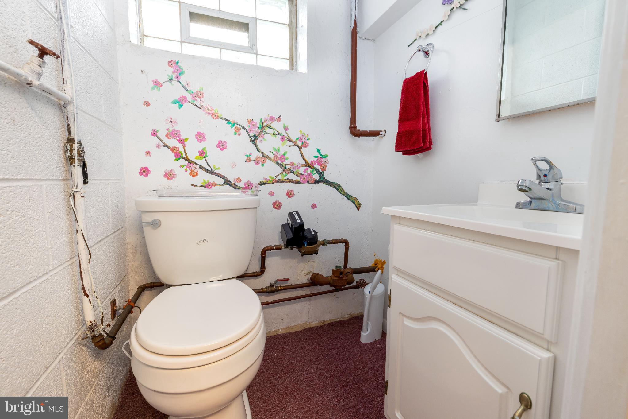 12704 Minden Road Philadelphia, PA 19154 - Photo 21 of 23 a bathroom with a toilet sink and curtain