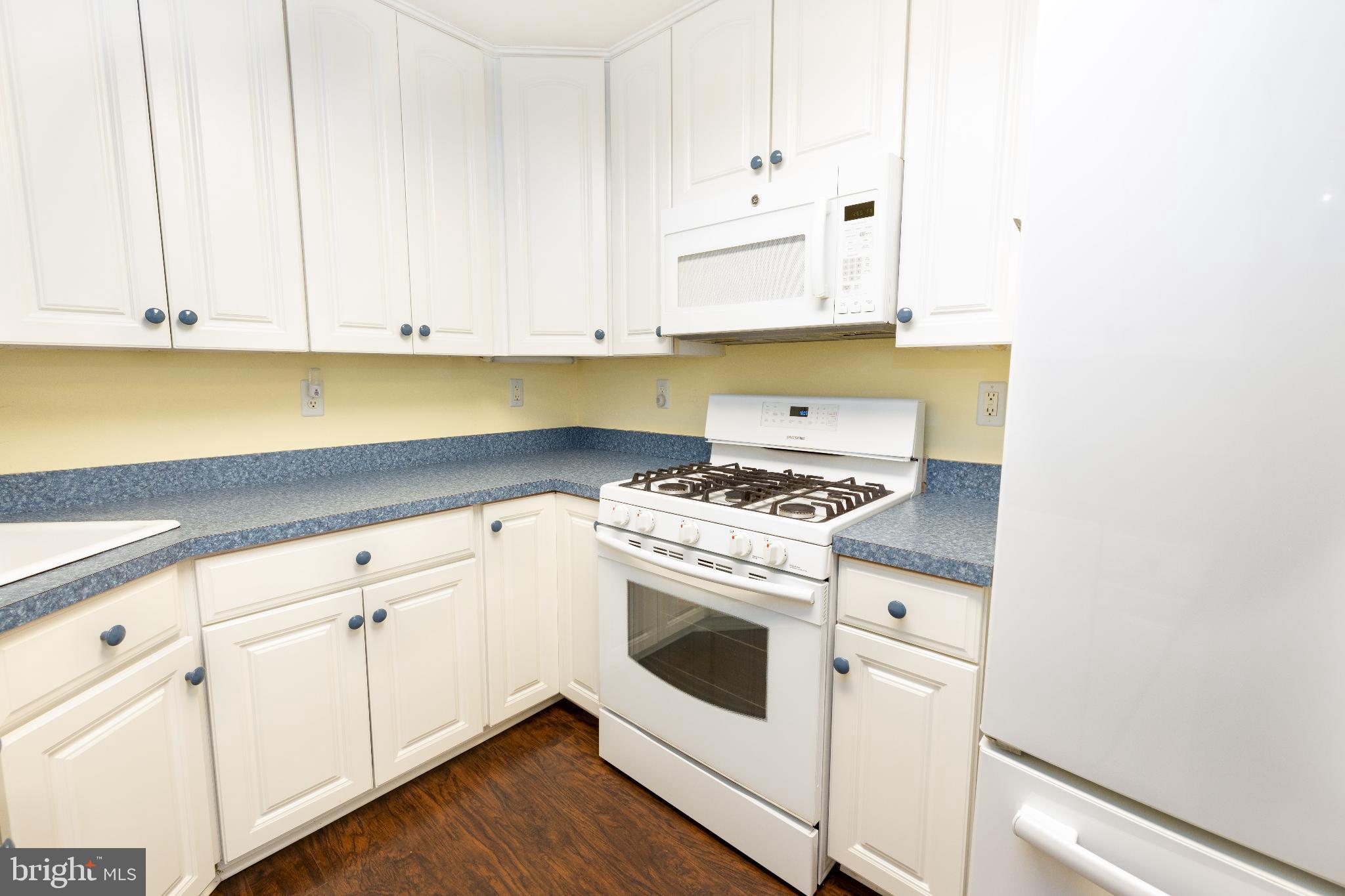 12704 Minden Road Philadelphia, PA 19154 - Photo 9 of 23 a kitchen with granite countertop white cabinets and white appliances