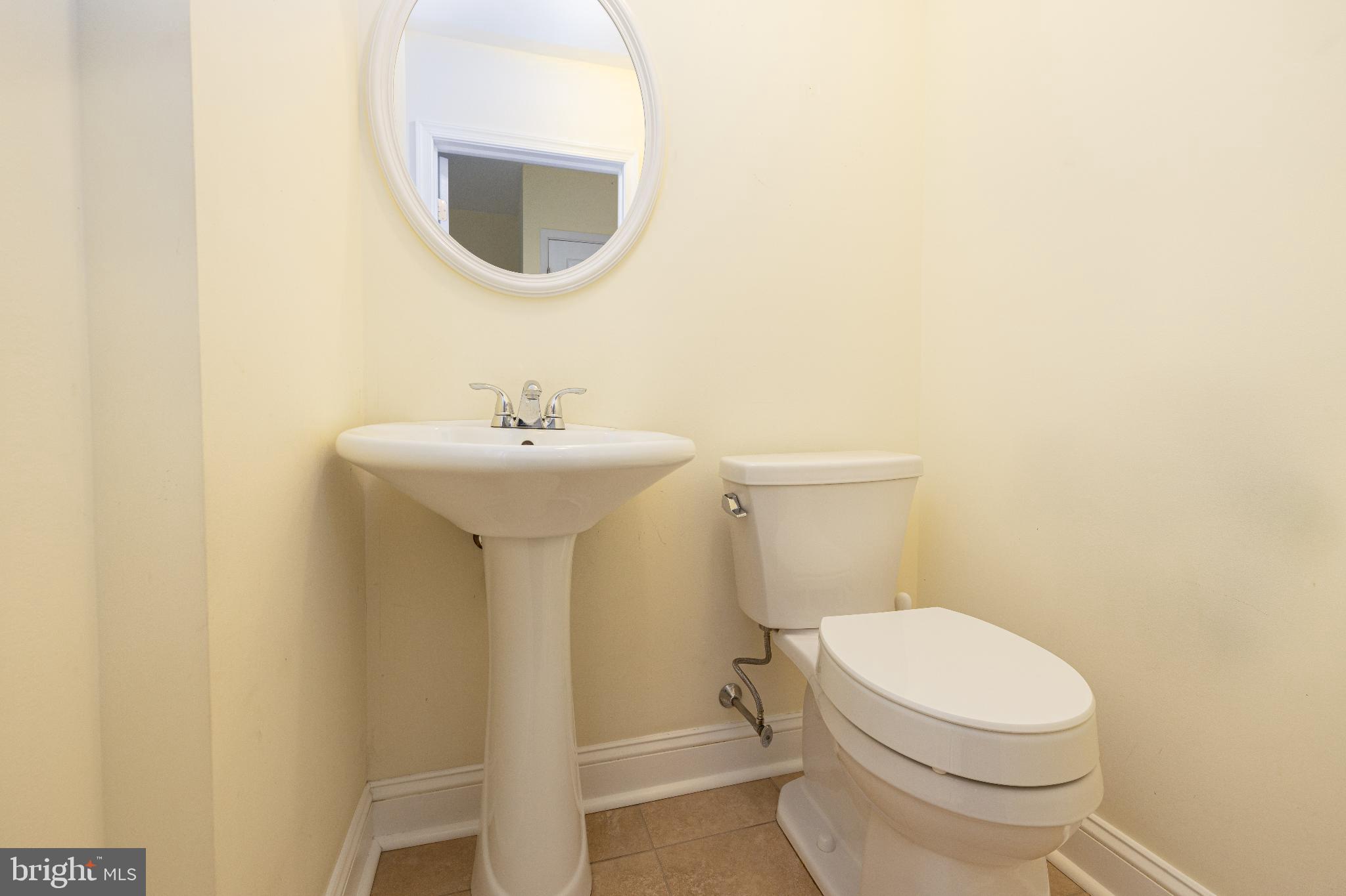 12704 Minden Road Philadelphia, PA 19154 - Photo 10 of 23 a white toilet sitting next to a bathroom sink