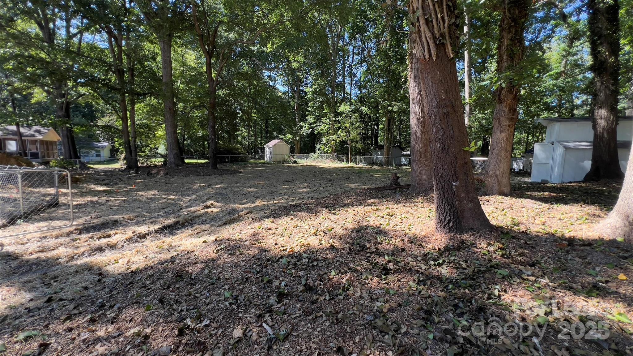 308 Robinson Avenue Matthews, NC 28104 - Photo 12 of 16 a view of a yard with plants and trees