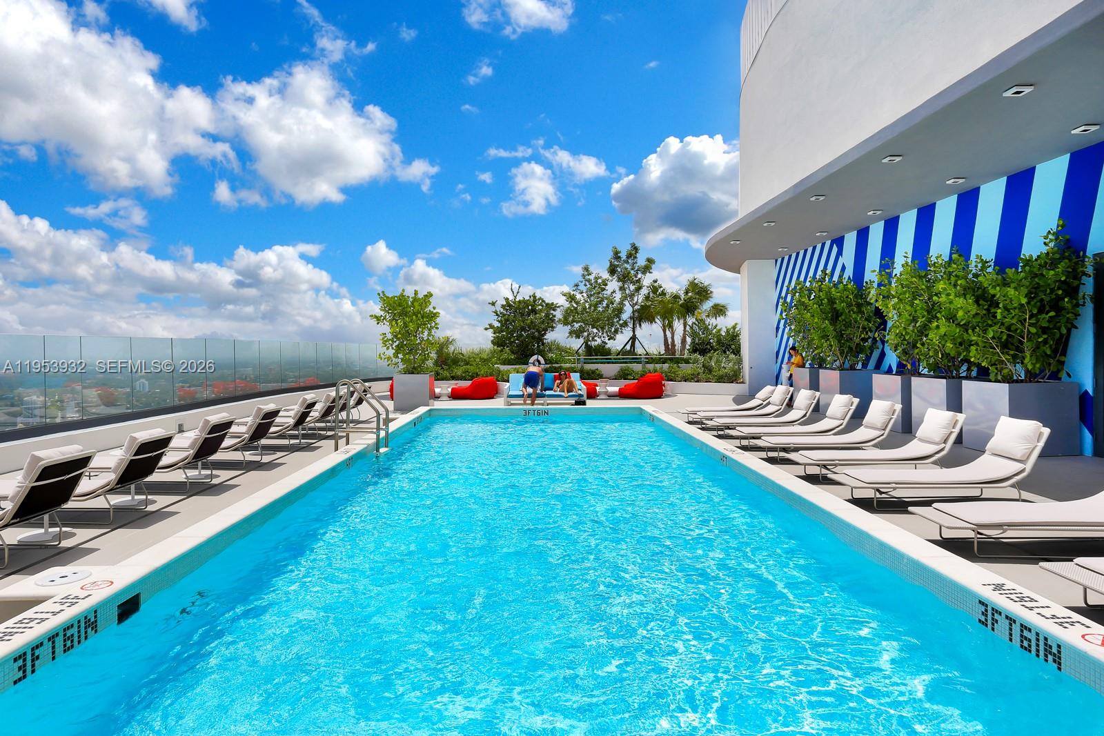 45 Southwest 9th Street, Unit 1806 Miami, FL 33130 - Photo 29 of 61 a view of a backyard with plants and patio