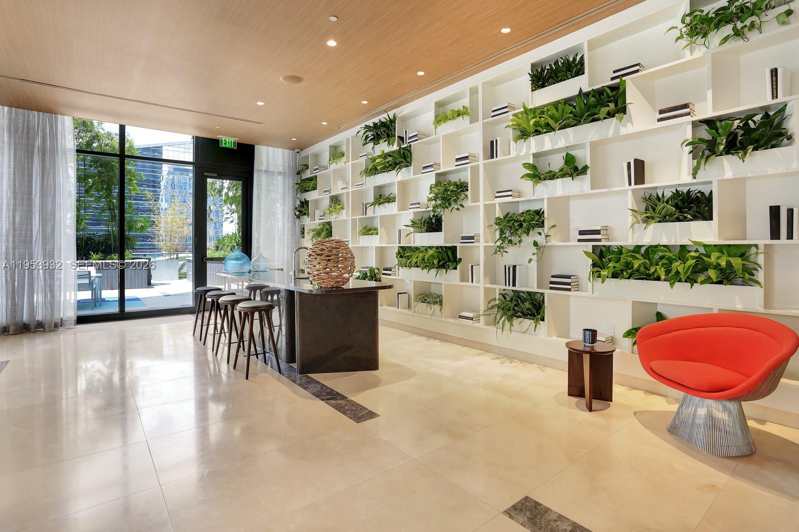 45 Southwest 9th Street, Unit 1806 Miami, FL 33130 - Photo 40 of 61 a lobby with furniture and large windows