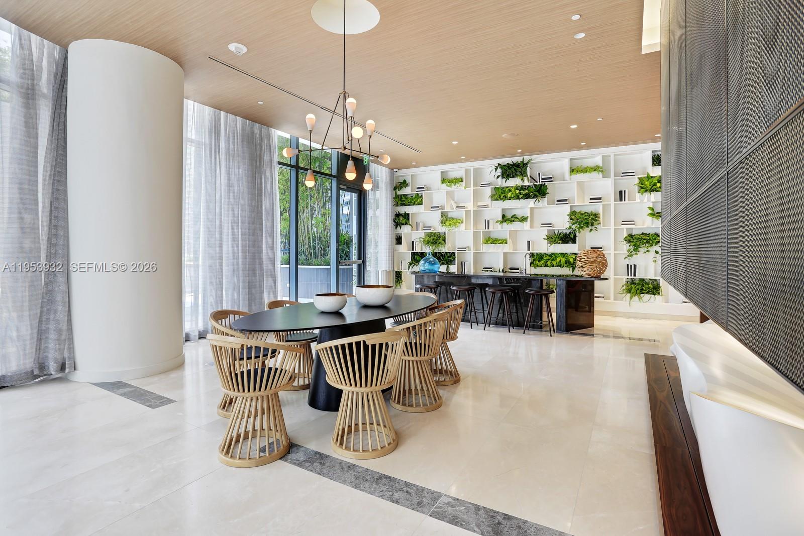 45 Southwest 9th Street, Unit 1806 Miami, FL 33130 - Photo 44 of 61 a kitchen with a table and chairs