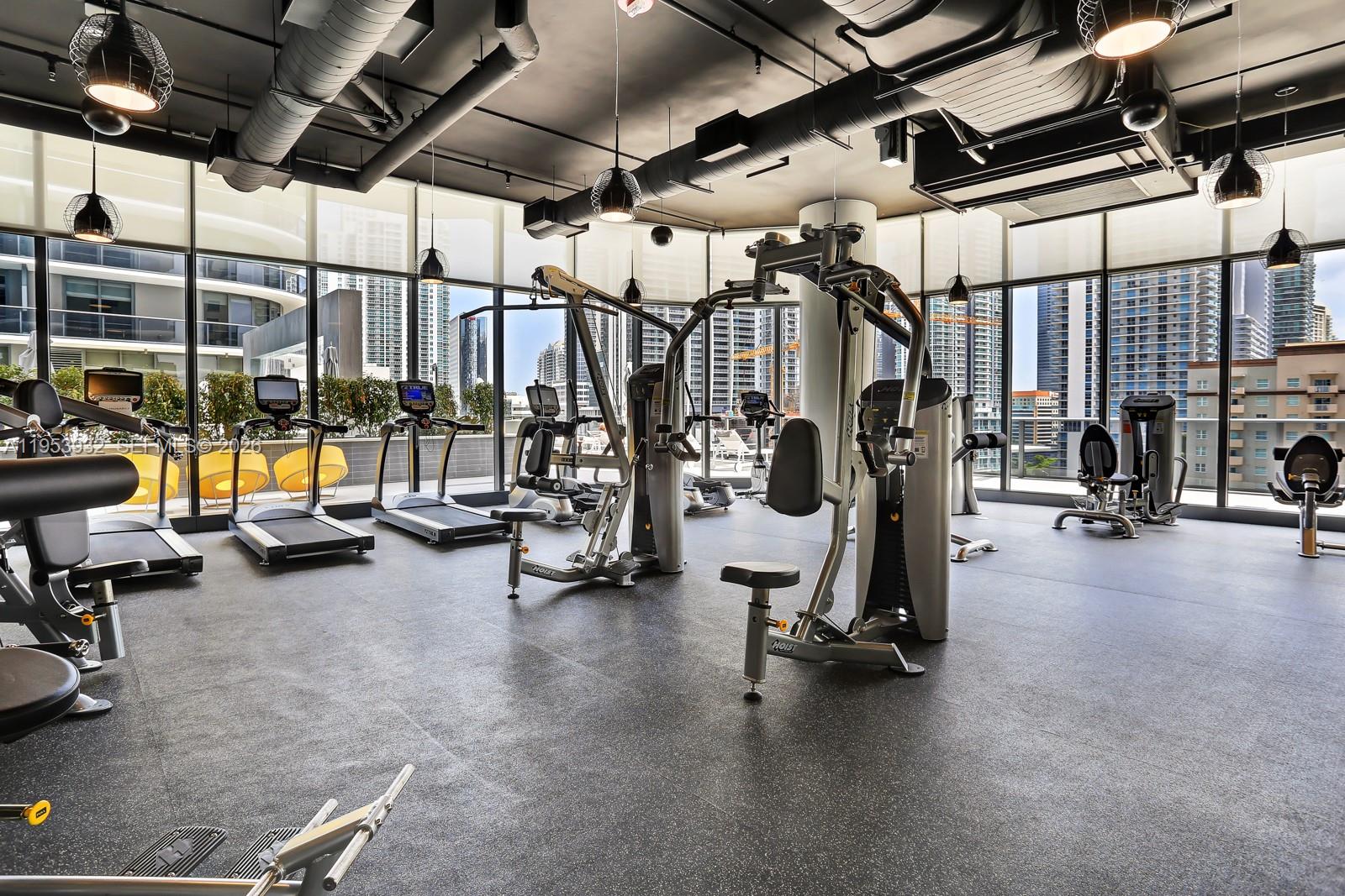 45 Southwest 9th Street, Unit 1806 Miami, FL 33130 - Photo 53 of 61 a view of a room with gym equipment