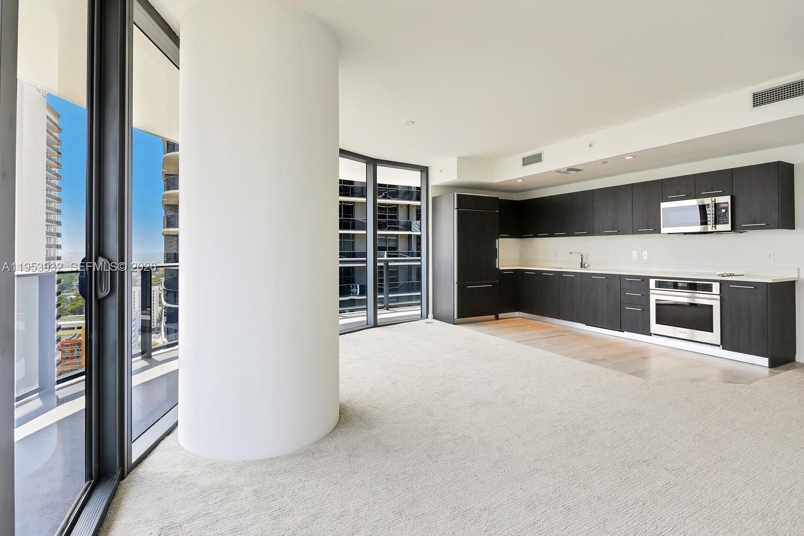 45 Southwest 9th Street, Unit 1806 Miami, FL 33130 - Photo 7 of 61 a big room with closet and windows