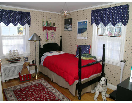 98 Richmond Road Belmont, MA 02478 - Photo 14 of 20 a bedroom with a bed and wooden floor