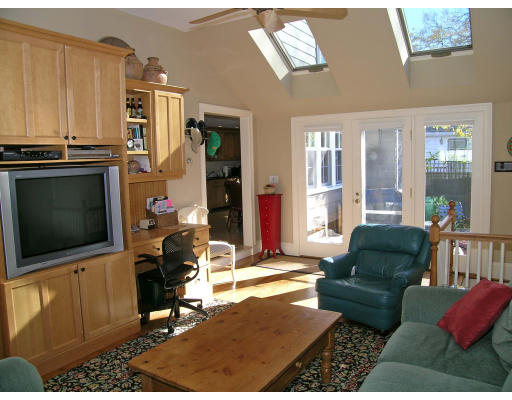 98 Richmond Road Belmont, MA 02478 - Photo 9 of 20 a living room with furniture a flat screen tv and large window