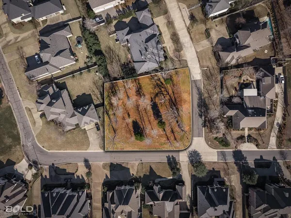 an aerial view of a highlighted house