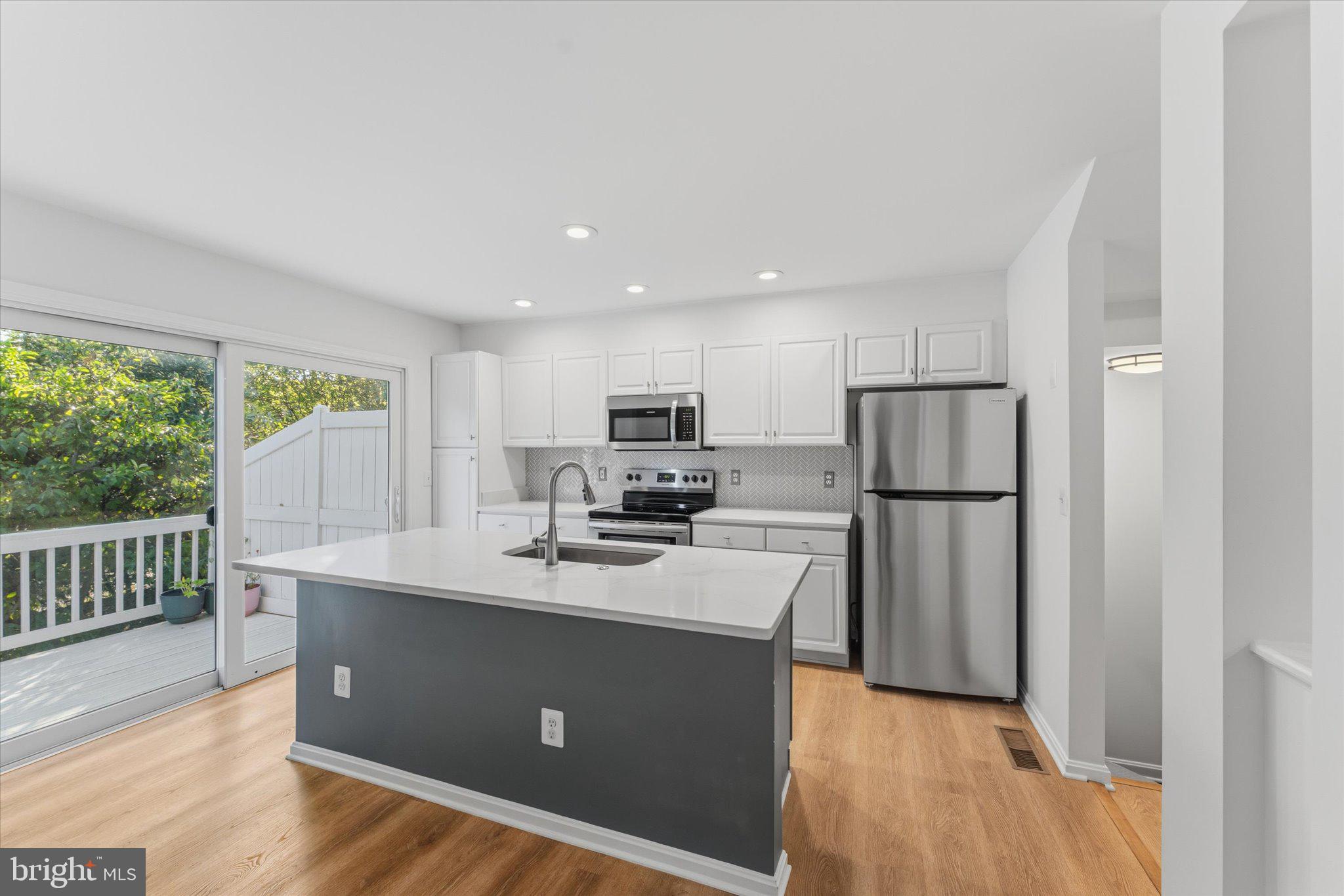 12066 Edgemere Circle Reston, VA 20190 - Photo 15 of 41 Renovated kitchen and private deck