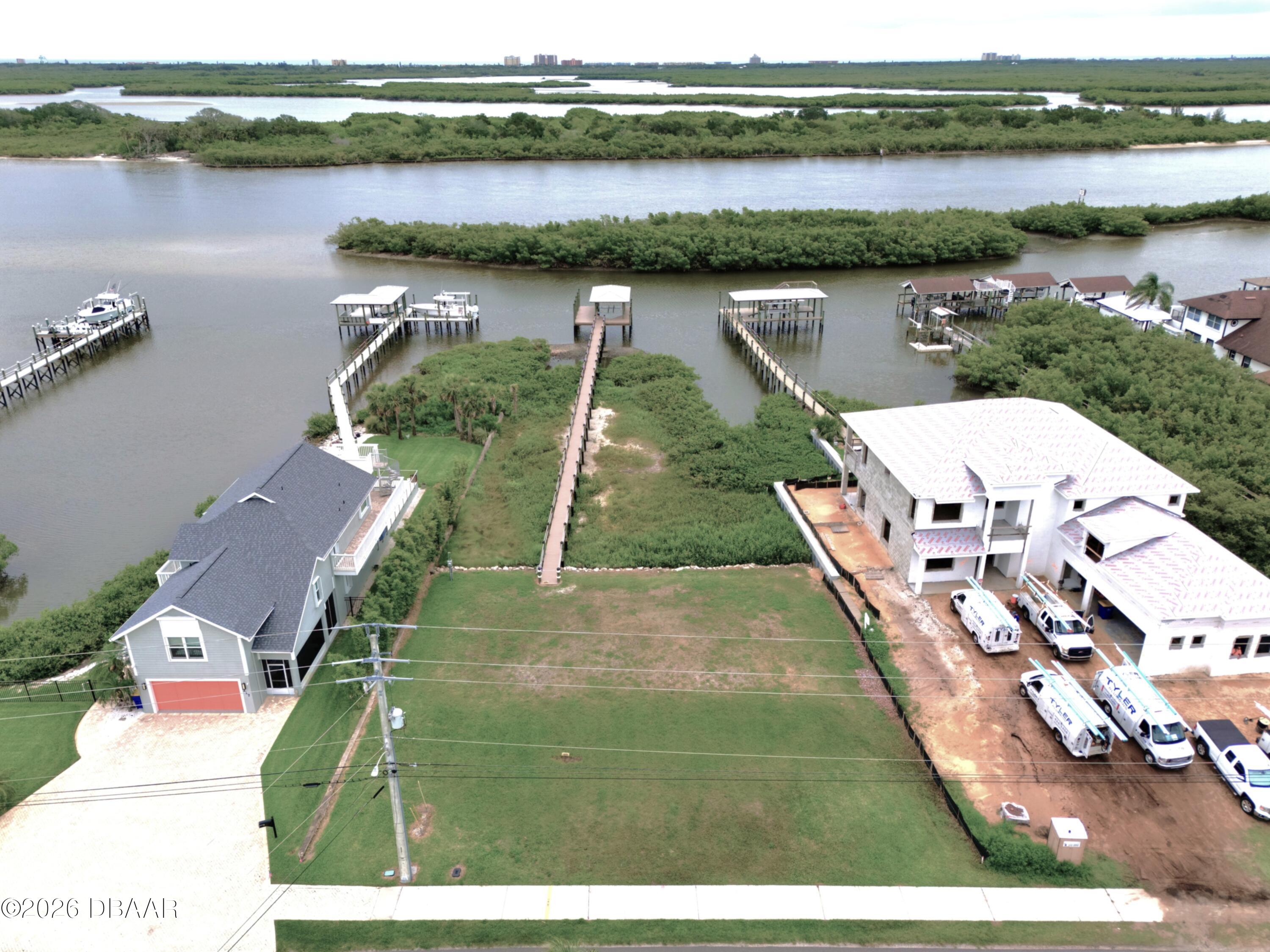 211 North Riverside Drive Edgewater, FL 32132 - Photo 2 of 10 an aerial view of a house with a lake view