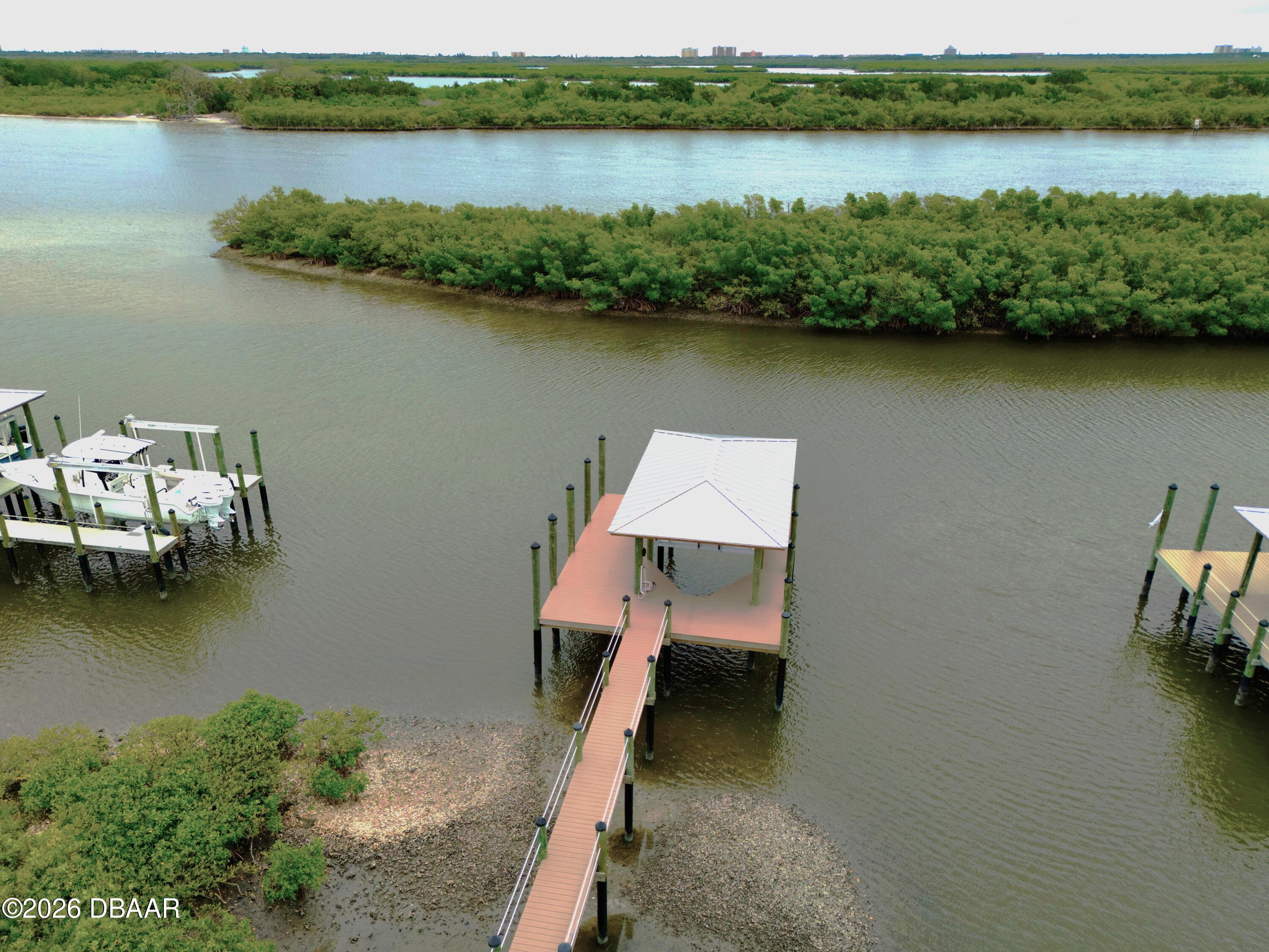 211 North Riverside Drive Edgewater, FL 32132 - Photo 8 of 10 an aerial view of a house with swimming pool and lake view