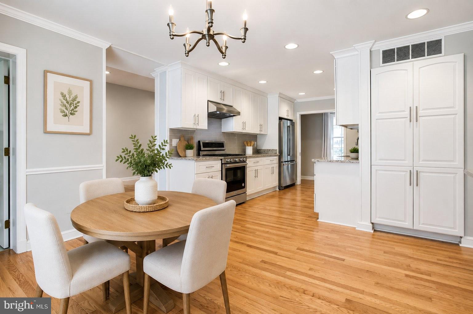 8500 Brook Road McLean, VA 22102 - Photo 12 of 59 a kitchen with a table and chairs in it