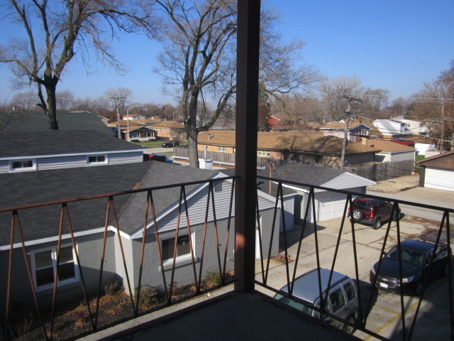 5724 West 111th Street, Unit 3B Chicago Ridge, IL 60415 - Photo 12 of 14 a view of a balcony with furniture