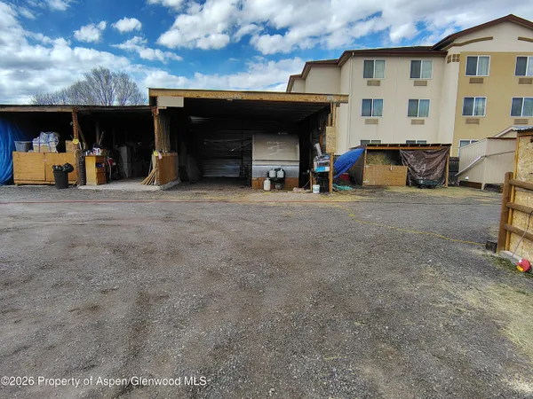 a view of a car park in front of a building